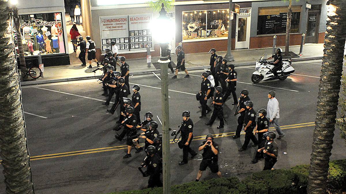 Armed police advance on civilians